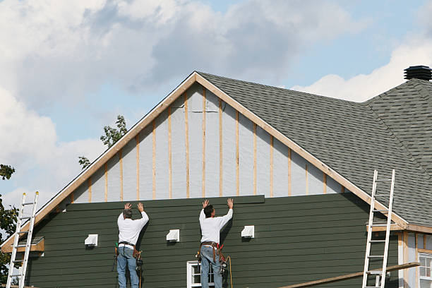 Professional Storm Damage Siding Repair technician working in West Mansfield, OH